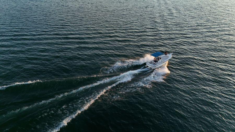 Boat on glassy water late in the afternoon