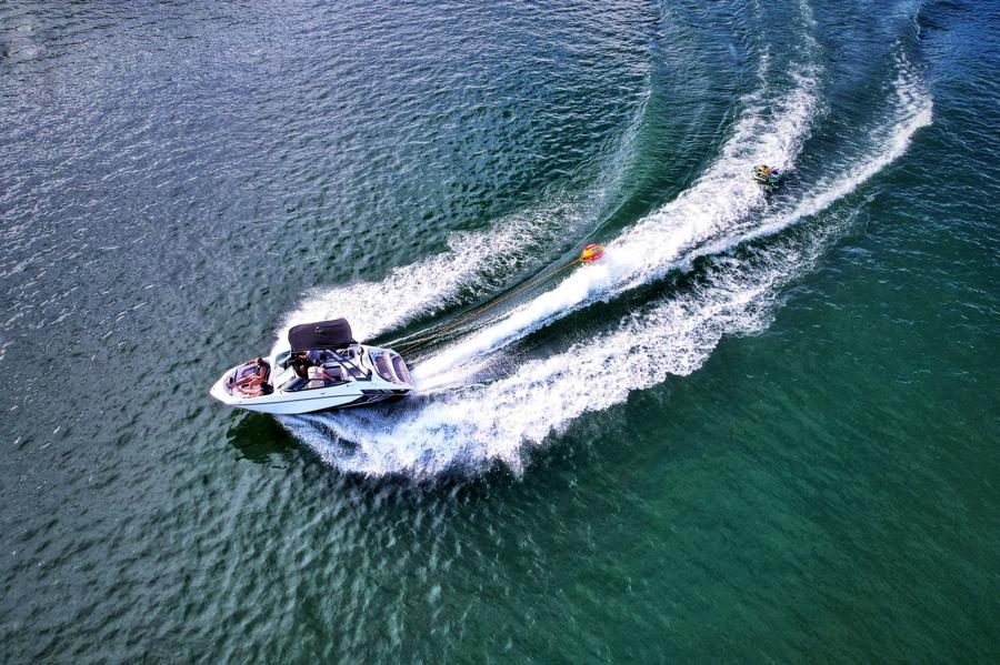Wake boat out on Bass Lake on a clear morning